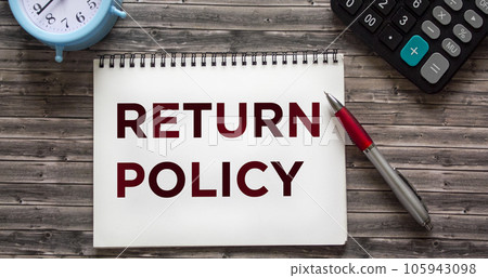 RETURN POLICY text written on notepad on wooden table RETURN POLICY text written on notepad on wooden table 105943098