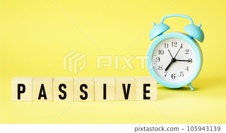 PASSIVE word made up of building blocks on a yellow background. 105943139