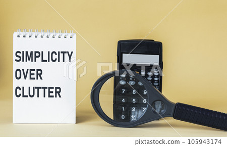 simplicity instead of clutter, an inspirational concept written on a notepad  105943174