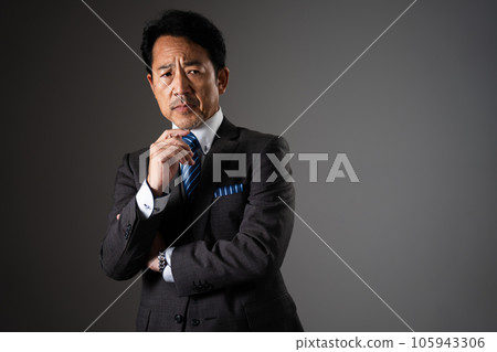 Middle-aged man posing business image Middle-aged man posing business image 105943306