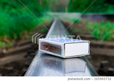 Matches on rails railroad tracks background, fire on railways concept 105943732