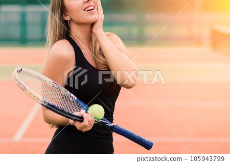 Tennis tournament. Female player at the clay tennis court 105943799