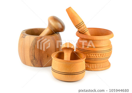 Beautiful wooden mortar and pestle isolated on white background. Beautiful wooden mortar and pestle isolated on white background. 105944680