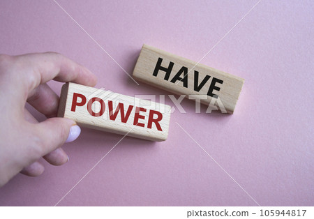Have power symbol. Wooden blocks with words have power. Businessman hand. Beautiful pink background. Business and have power concept. Copy space. Have power symbol. Wooden blocks with words have power. Businessman hand. Beautiful pink background. Business and have power concept. Copy space. 105944817