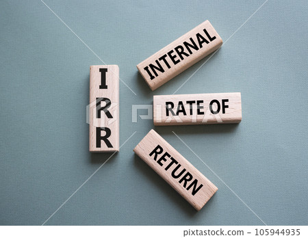 IRR - Internal Rate of Return symbol. Concept word IRR on wooden cubes. Beautiful grey green background. Business and IRR concept. Copy space. IRR - Internal Rate of Return symbol. Concept word IRR on wooden cubes. Beautiful grey green background. Business and IRR concept. Copy space. 105944935