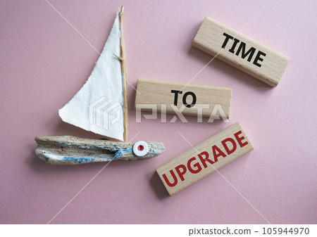 Time to Upgrade symbol. Concept words Time to Upgrade on wooden blocks. Beautiful pink background with boat. Business and Time to Upgrade concept. Copy space. Time to Upgrade symbol. Concept words Time to Upgrade on wooden blocks. Beautiful pink background with boat. Business and Time to Upgrade concept. Copy space. 105944970
