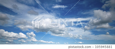 Blue sky with fluffy white and gray clouds Blue sky with fluffy white and gray clouds 105945881