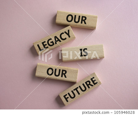 Our Legacy is our Future symbol. Concept words Our Legacy is our Future on wooden blocks. Beautiful pink background. Business and Our Legacy is our Future concept. Copy space 105946028
