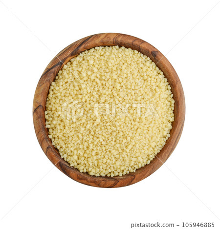 Raw couscous in wooden bowl Raw couscous in wooden bowl 105946885