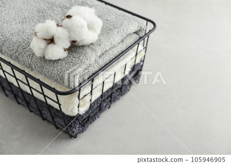 towels with cotton flowers in black metal basket towels with cotton flowers in black metal basket 105946905