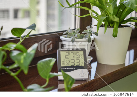 Thermometer hygrometer measuring the optimum temperature and humidity in a house 105947614