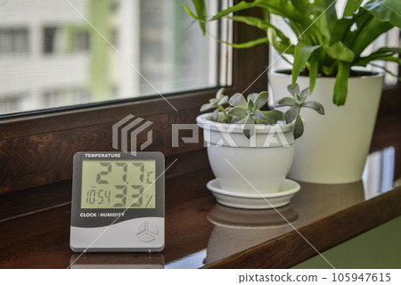 Thermometer hygrometer measuring the optimum temperature and humidity in a house 105947615