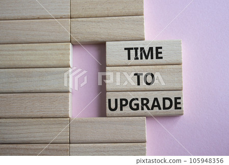 Time to Upgrade symbol. Concept words Time to Upgrade on wooden blocks. Beautiful pink background. Business and Time to Upgrade concept. Copy space. Time to Upgrade symbol. Concept words Time to Upgrade on wooden blocks. Beautiful pink background. Business and Time to Upgrade concept. Copy space. 105948356