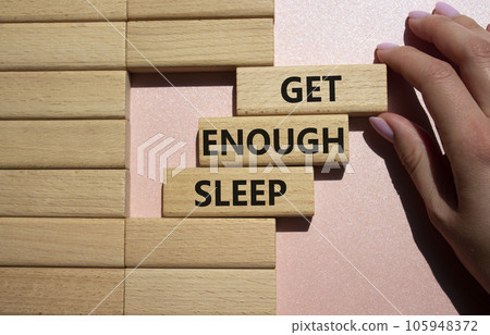 Get enough sleep symbol. Wooden blocks with words Get enough sleep. Beautiful pink background. Doctors hand. Healthy lifestyle, medical and Get enough sleep concept. Copy space. Get enough sleep symbol. Wooden blocks with words Get enough sleep. Beautiful pink background. Doctors hand. Healthy lifestyle, medical and Get enough sleep concept. Copy space. 105948372