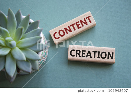 Content creation symbol. Concept word Content creation on wooden blocks. Businessman hand. Beautiful grey green background with succulent plant. Business and Content creation concept. Copy space 105948407