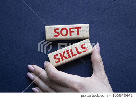 Soft skills symbol. Wooden blocks with words Soft skills. Beautiful deep blue background. Businessman hand. Business and Soft skills concept. Copy space. Soft skills symbol. Wooden blocks with words Soft skills. Beautiful deep blue background. Businessman hand. Business and Soft skills concept. Copy space. 105948441