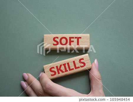 Soft skills symbol. Wooden blocks with words Soft skills. Beautiful grey green background. Businessman hand. Business and Soft skills concept. Copy space. Soft skills symbol. Wooden blocks with words Soft skills. Beautiful grey green background. Businessman hand. Business and Soft skills concept. Copy space. 105948454