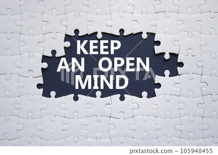 Keep an open mind symbol. White puzzle with words Keep an open mind. Beautiful black background. Business and Keep an open mind concept. Copy space. Keep an open mind symbol. White puzzle with words Keep an open mind. Beautiful black background. Business and Keep an open mind concept. Copy space. 105948455
