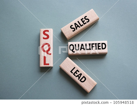 SQL - Sales Qualified Lead. Wooden cubes with words SQL. Beautiful grey green background. Business and SQL concept. Copy space. 105948518