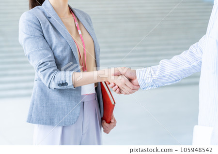 Business woman shaking hands Business woman shaking hands 105948542