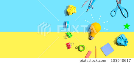 Idea light bulb with school supplies - flat lay Idea light bulb with school supplies - flat lay 105948617