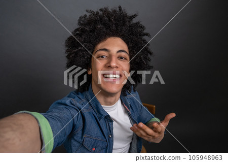 Young guy making selfie and looking excited Young guy making selfie and looking excited 105948963