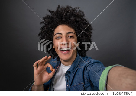 Young guy making selfie and looking excited 105948964