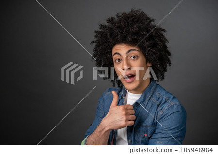 Contented smiling guy looking happy and pleased Contented smiling guy looking happy and pleased 105948984