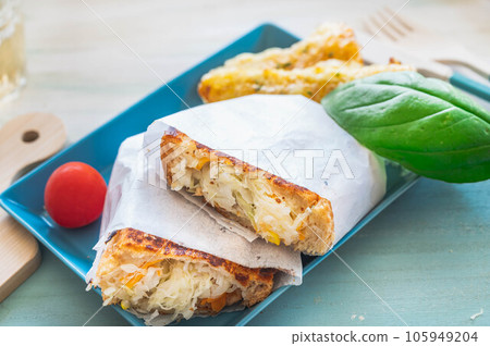 Hot Sandwich with Homemade Vegetable Salad 105949204