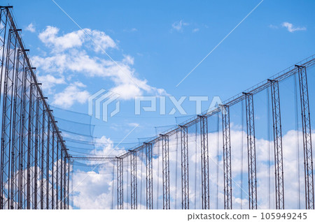 Ball net and blue sky golf driving range Ball net and blue sky golf driving range 105949245