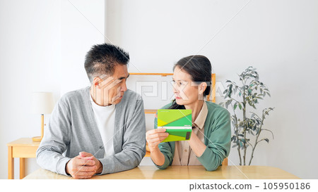 Senior couple thinking with a bankbook 105950186