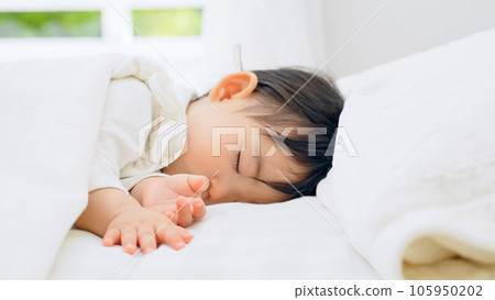 sleeping face of a baby taking a nap 105950202