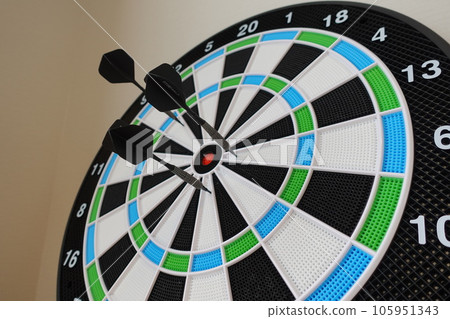 A darts boat with three arrows stuck in it 105951343