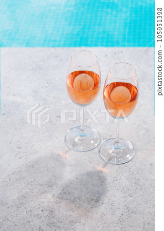 Refreshing rose wine by the pool on a sunny day Refreshing rose wine by the pool on a sunny day 105951398