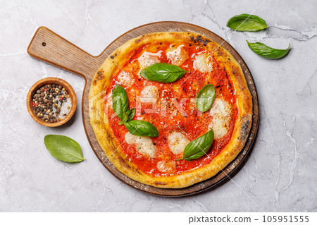 Margarita pizza with tomatoes, mozzarella cheese and basil Margarita pizza with tomatoes, mozzarella cheese and basil 105951555
