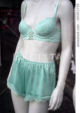 Closeup of blue bra one blue shorty on mannequin in a fashion store showroom Closeup of blue bra one blue shorty on mannequin in a fashion store showroom 105951739