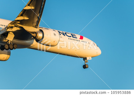 [Air France plane landing from Jonanjima Seaside Park at sunset] 105953886