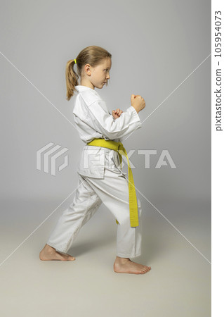 child practises martial arts 105954073