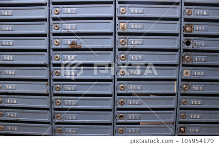Old mailboxes on the wall in the entrance of an apartment building Old mailboxes on the wall in the entrance of an apartment building 105954170