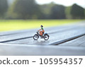 A woman riding a bicycle A woman riding a bicycle 105954357