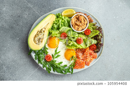Healthy eating food vegetables salad, avocado, fish, eggs, nuts peanut paste. low carb keto ketogenic diet. Long banner format. top view 105954408