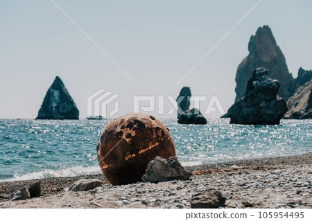 Old rusty sea mine on the beach. Old rusty sea mine on the beach. 105954495