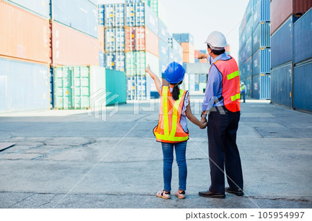 Man adult takes child girl by hand stand and look at containers. Studying for the future. 105954997