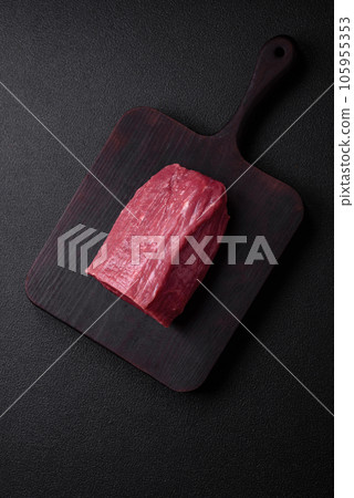 Juicy fresh raw beef meat with salt, spices and herbs Juicy fresh raw beef meat with salt, spices and herbs 105955353