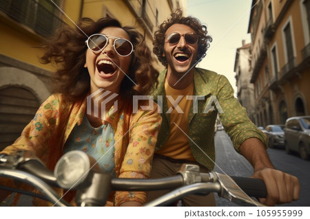 Couple on bike together riding in a city Couple on bike together riding in a city 105955999