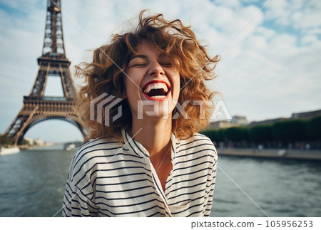 Beautiful young woman enjoying time in front of eiffel tower 105956253