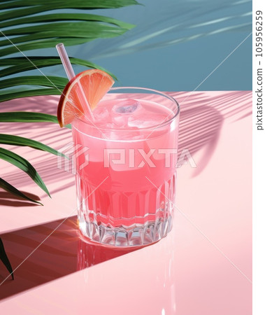 Pink cocktail with lemon wedge sitting on the pool table Pink cocktail with lemon wedge sitting on the pool table 105956259