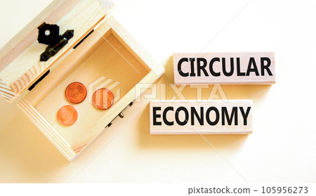 Circular economy symbol. Concept words Circular economy on wooden blocks. Beautiful white table white background. Wooden chest with coins. Business circular economy concept. Copy space. Circular economy symbol. Concept words Circular economy on wooden blocks. Beautiful white table white background. Wooden chest with coins. Business circular economy concept. Copy space. 105956273