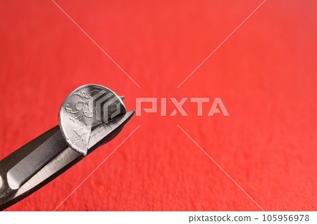 Russian ruble, scissors cut a coin with a face value of 1 Russian ruble on an orange background. The idea of the collapse of the ruble and the economy, sanctions against Russian aggression Russian ruble, scissors cut a coin with a face value of 1 Russian ruble on an orange background. The idea of the collapse of the ruble and the economy, sanctions against Russian aggression 105956978