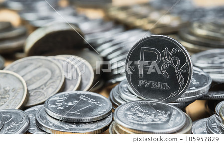 Coins of the Russian ruble, change in the exchange rate of the ruble. Idea for economic news banner. Blurred out of focus background, bokeh and pasteurization. The collapse of the Russian economy Coins of the Russian ruble, change in the exchange rate of the ruble. Idea for economic news banner. Blurred out of focus background, bokeh and pasteurization. The collapse of the Russian economy 105957829